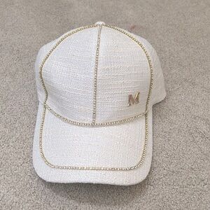 white baseball cap w/ pearl & jewel beading letter “M” symbol gold metallic
